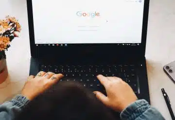 person using black laptop computer