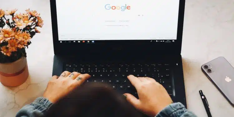 person using black laptop computer